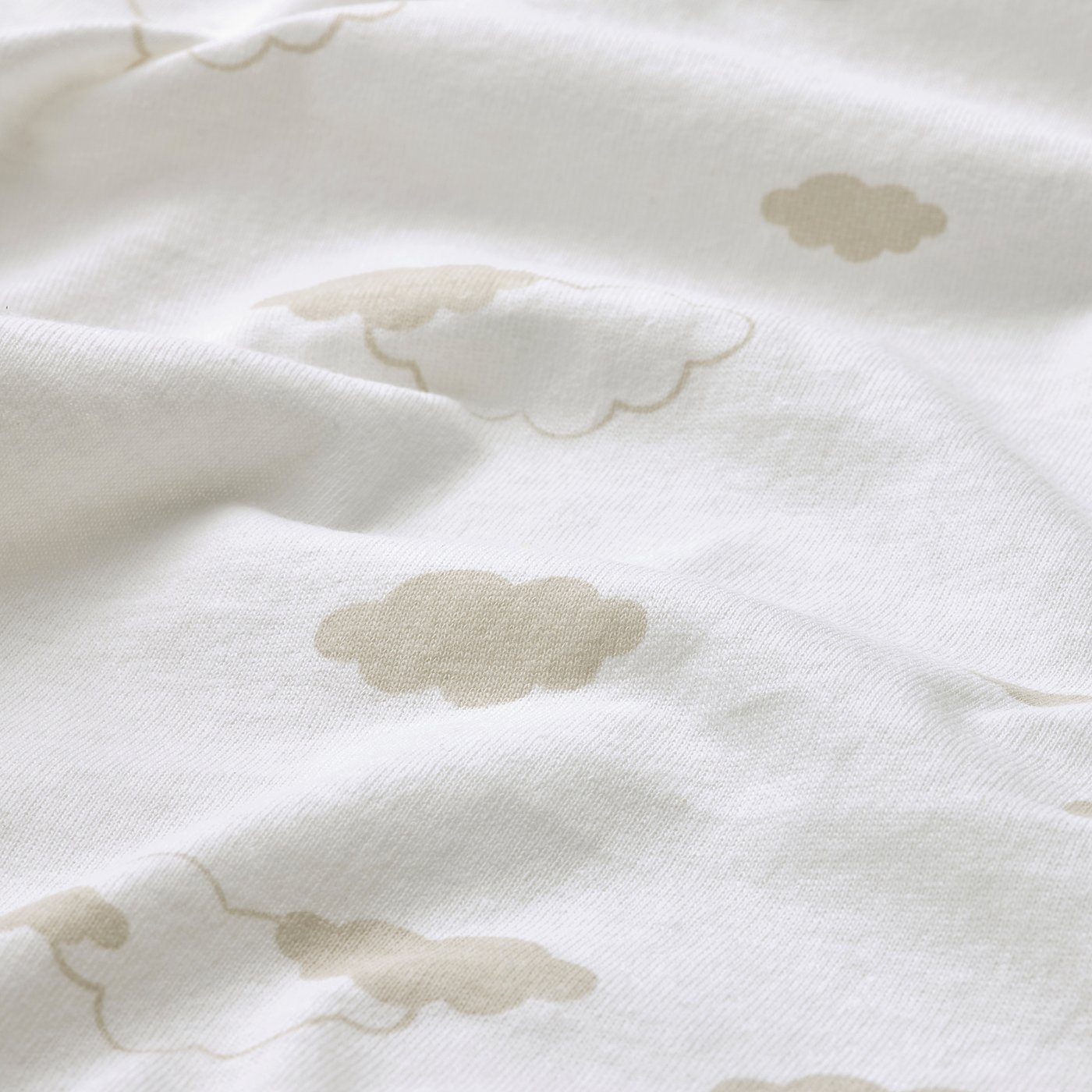Soft, white cotton fabric with subtle, scattered cloud patterns, likely a blanket.