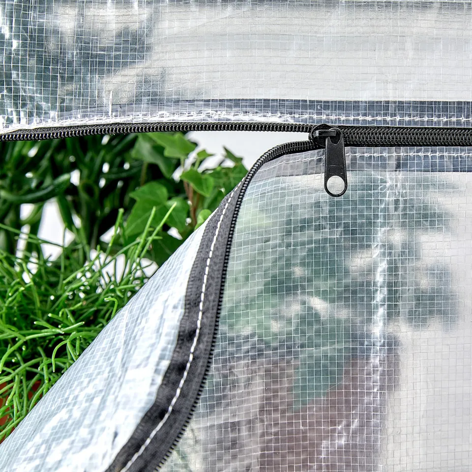 Plant greenhouse cover with zip, featuring clear plastic and sturdy black zip, designed for protection and ventilation.