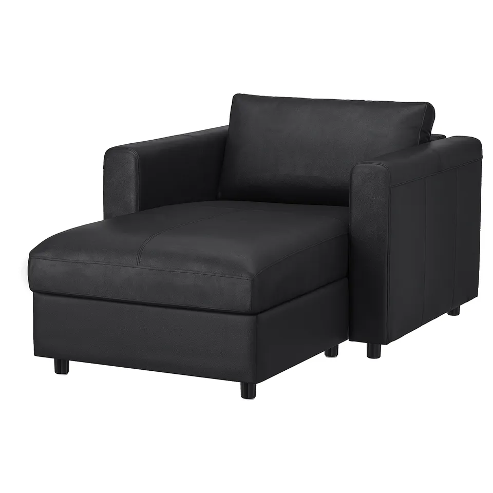 A black VIMLE modular sofa with a storage chaise. It a modern design with clean lines and dark grey upholstery.