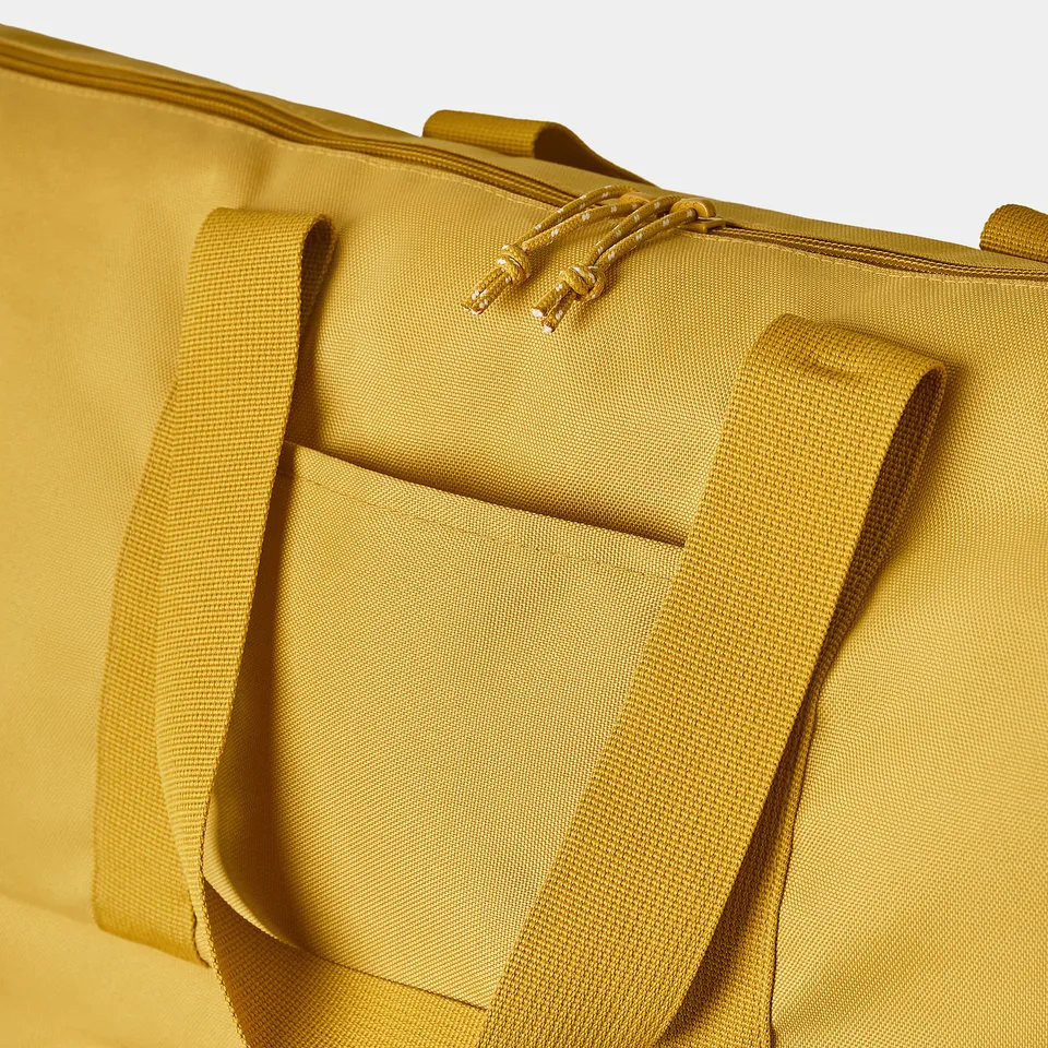 Durable, mustard yellow cooler bag with sturdy handles and side pockets for organised storage.