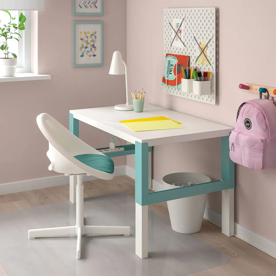 Small white seat pad for kids desk chair. Fits perfectly under desk, adding comfort.