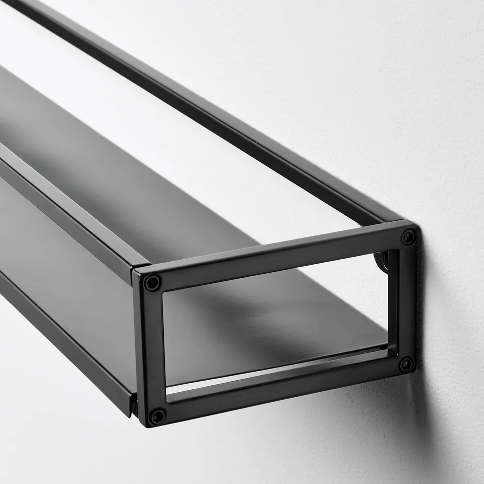 Black metal shelf, sleek design, sturdy frame, mounted on wall, minimalist style.