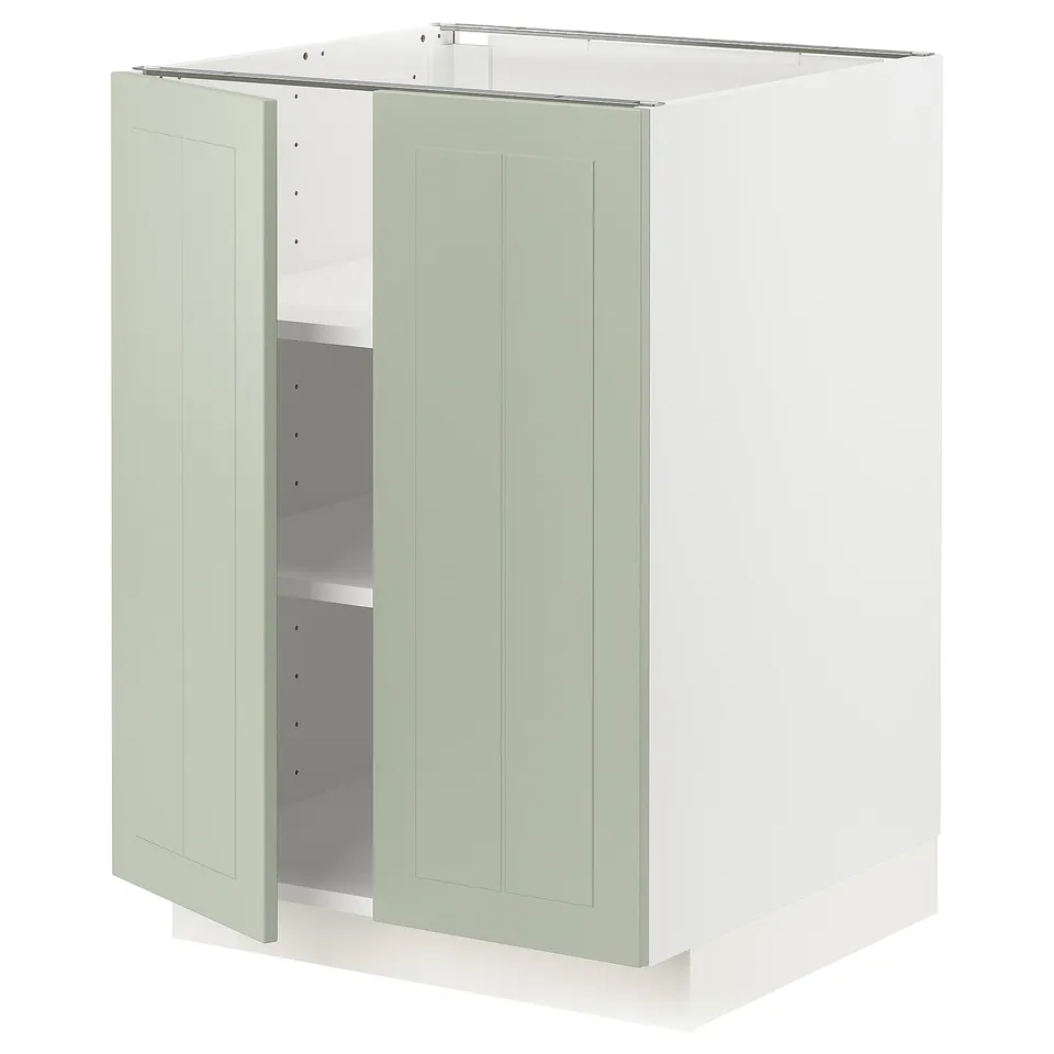 Green METOD kitchen cabinet with adjustable shelves and reversible door.