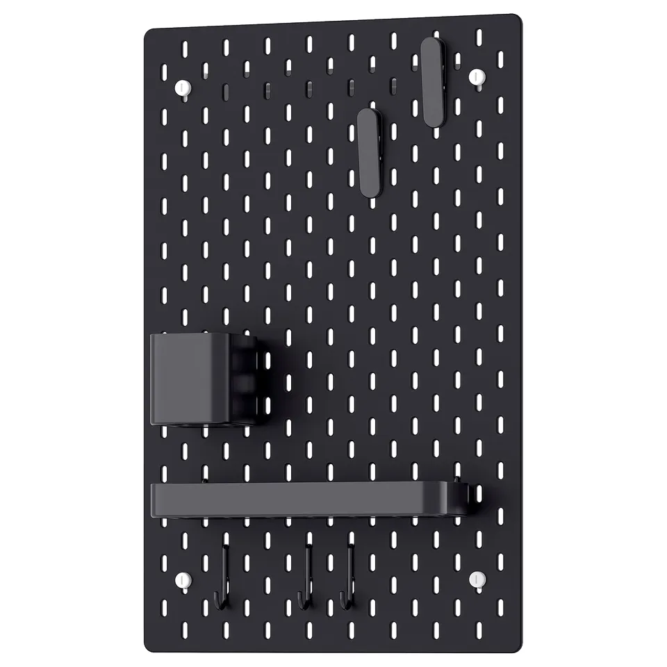 A black SKÅDIS pegboard with multiple hooks and holders. It is a practical organisation tool with a rectangular shape and evenly spaced holes.