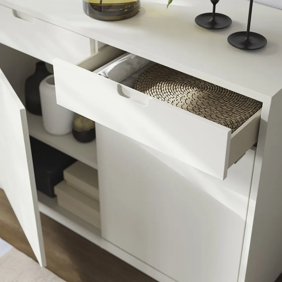 White TONSTAD cabinet with woven drawer, soft-close feature, stylish handle, and adjustable shelves.
