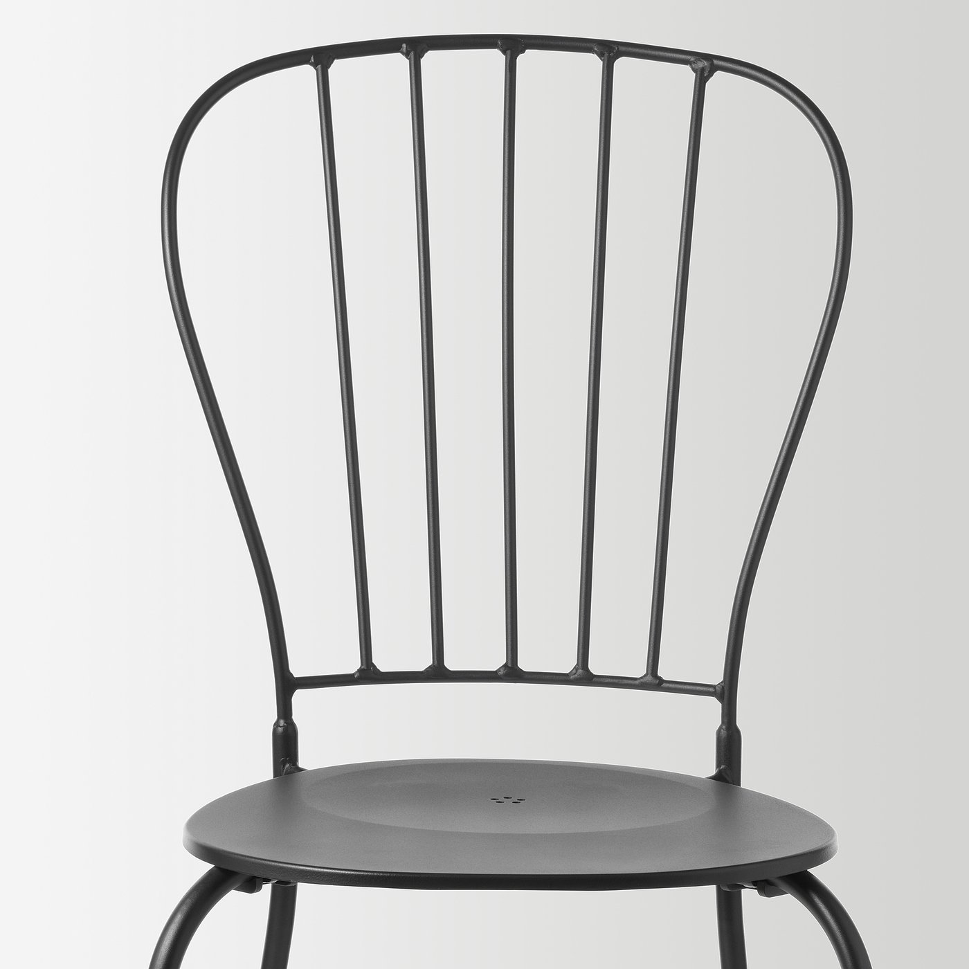 Modern black metal chair with curved back, sturdy design, minimalist style.