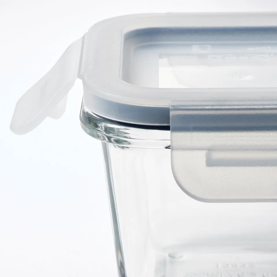 Clear glass food container with snap-on lid, showing quality craftsmanship and airtight seal.