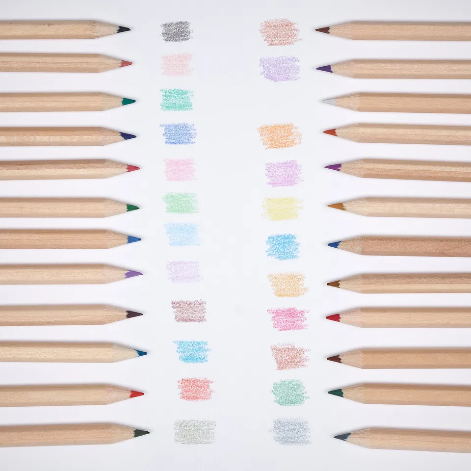 Assorted coloured pencils with swatched colours, arranged neatly in rows on white background. Displays variety of colours and pencil tips.