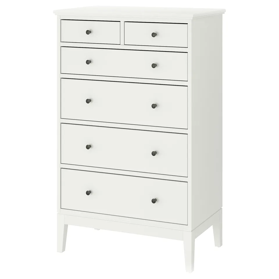 A white IDANÄS high chest of drawers with six drawers. It has a classic design with wooden knobs and slim legs, offering ample storage.