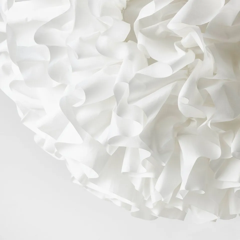 Cloud-like white pendant lamp with soft, recycled material, creating a cosy mood light.
