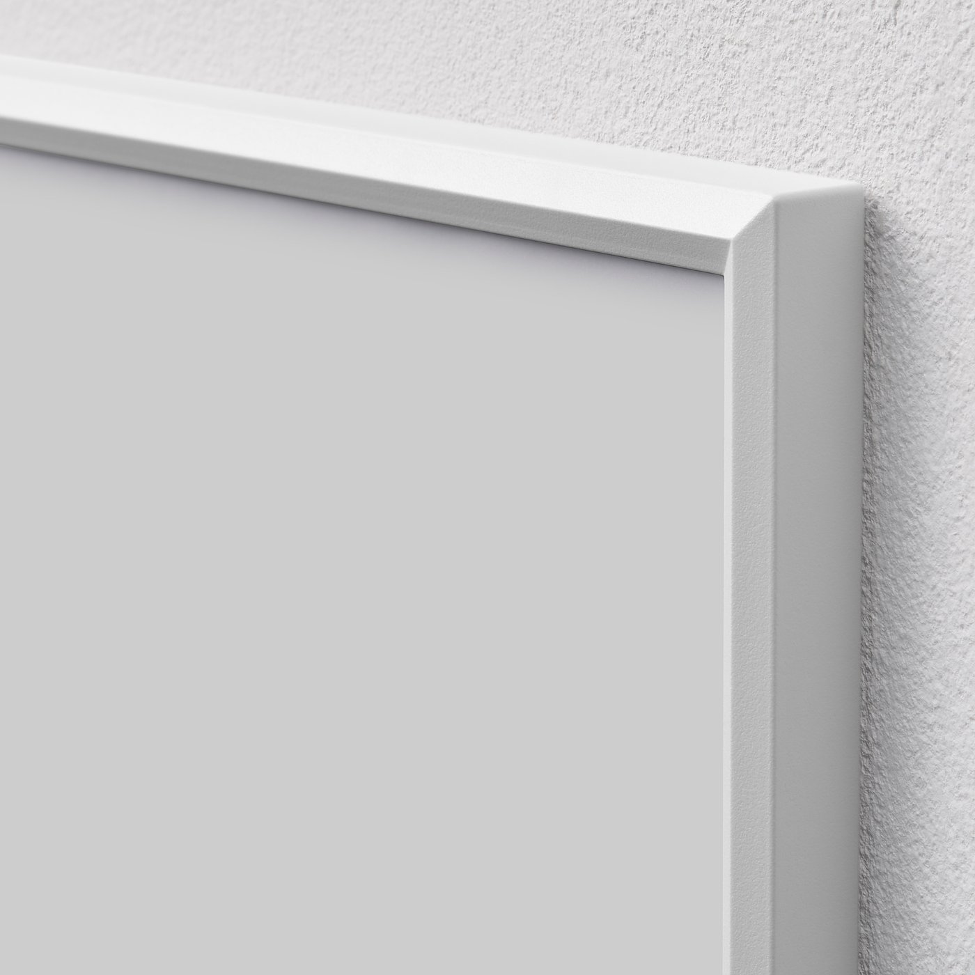 Close-up of a white picture frames corner, showing sleek design and quality material.