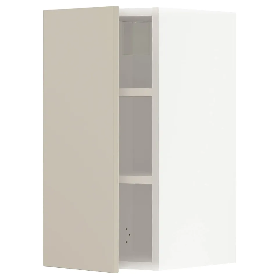 A beige METOD kitchen cabinet with adjustable shelves. It a sleek, rectangular design and a smooth finish.