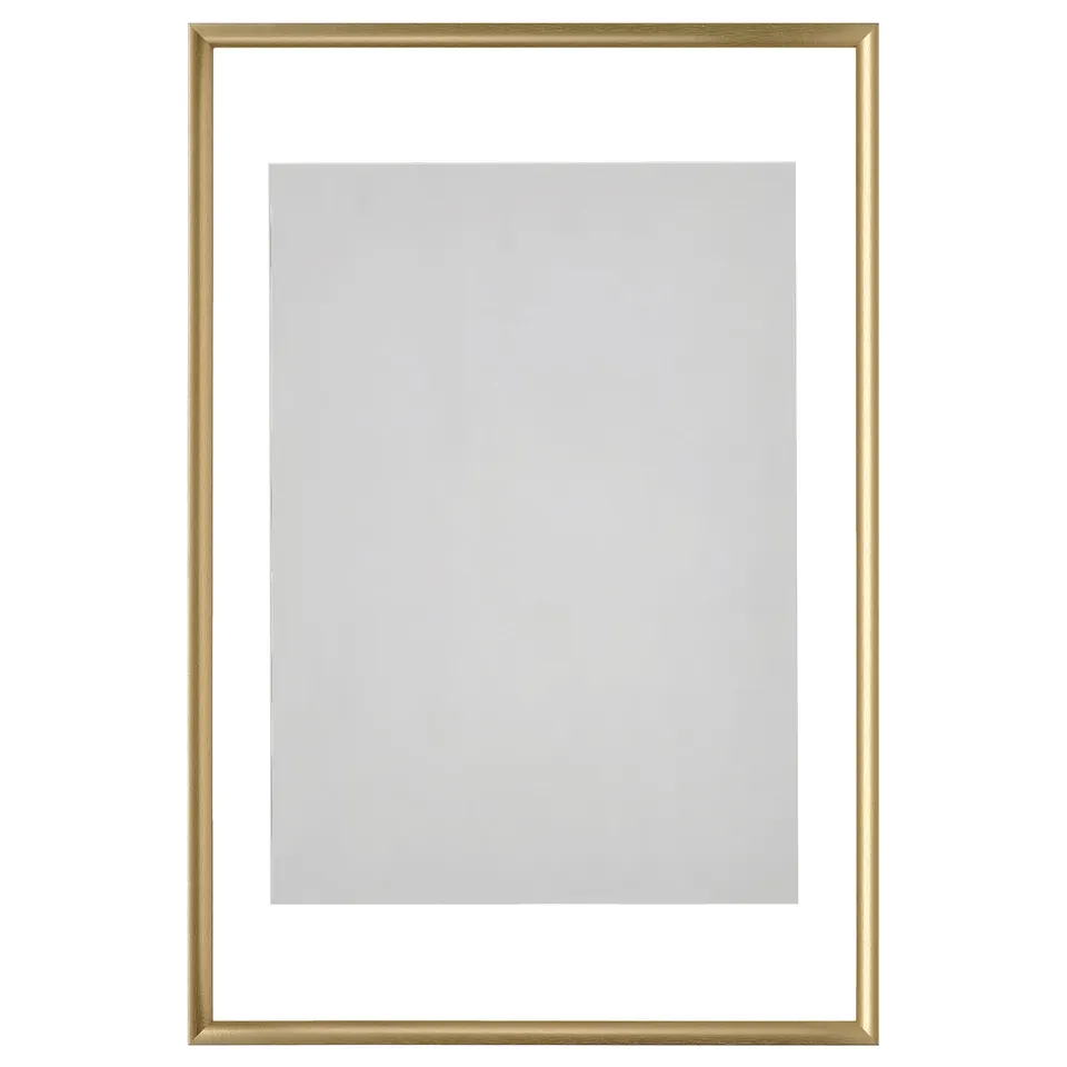 Empty gold picture frame, rectangular shape, sleek modern design.