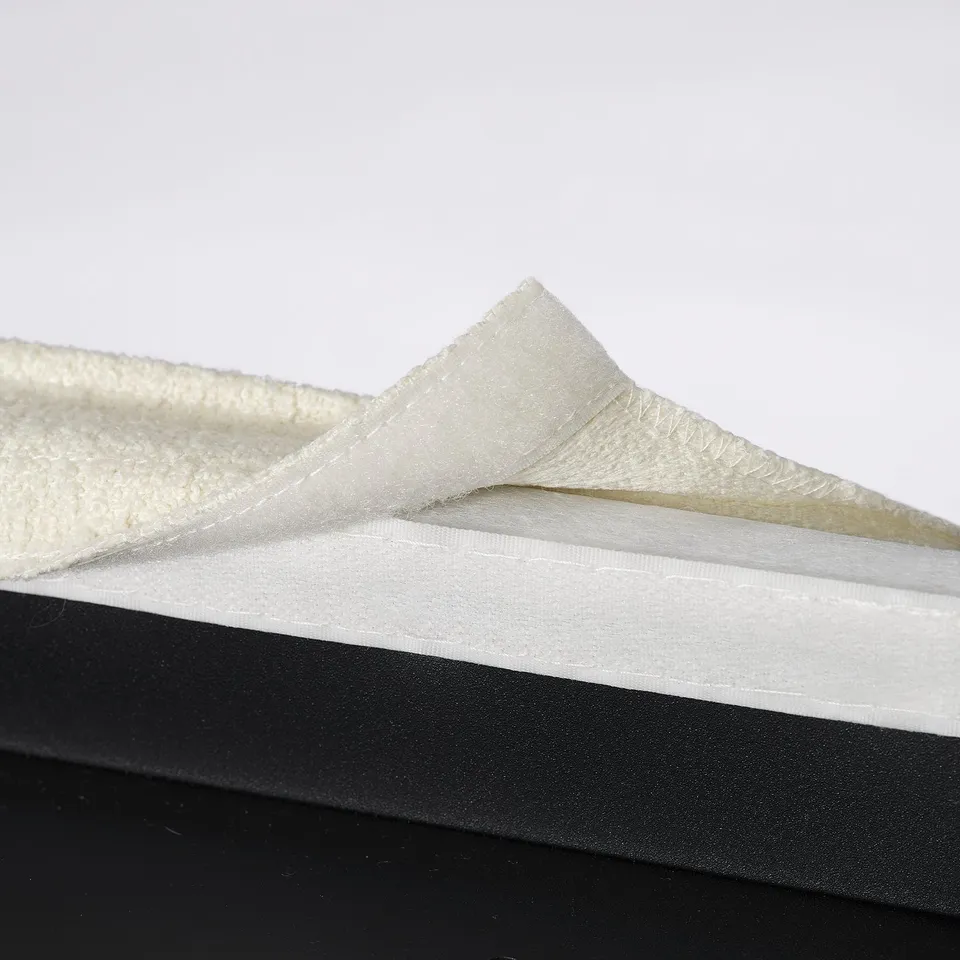 Close-up of washable, removable chair cover, showcasing elastic and durable stitching, meant for comfort and easy cleaning.