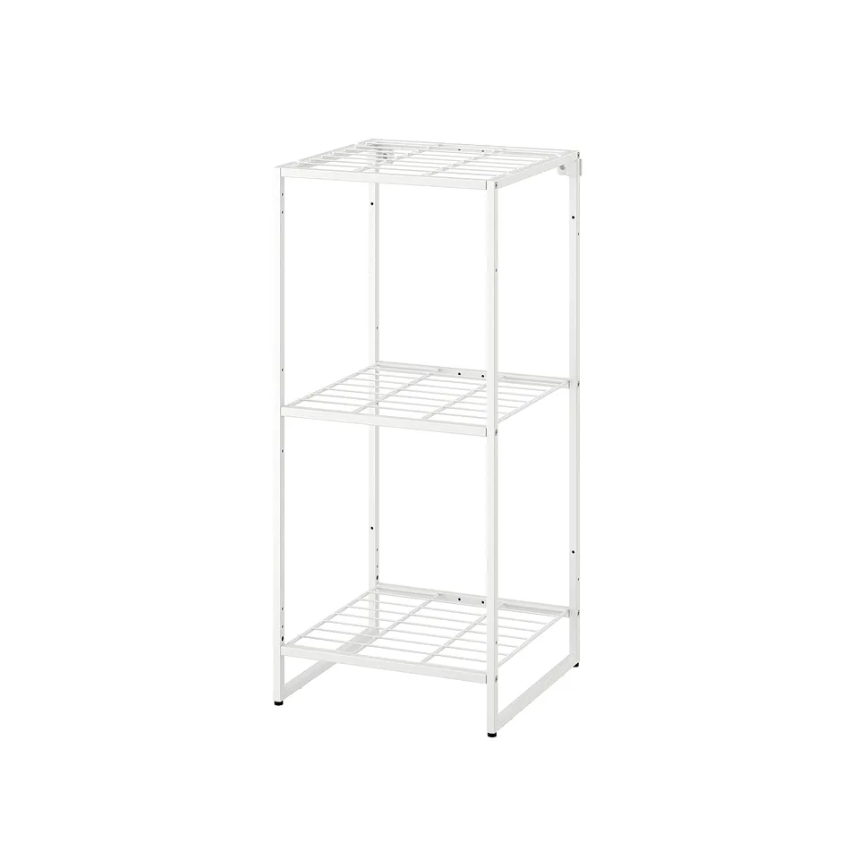A JOSTEIN white metal storage shelf with three tiers, ideal for small spaces and humid areas.