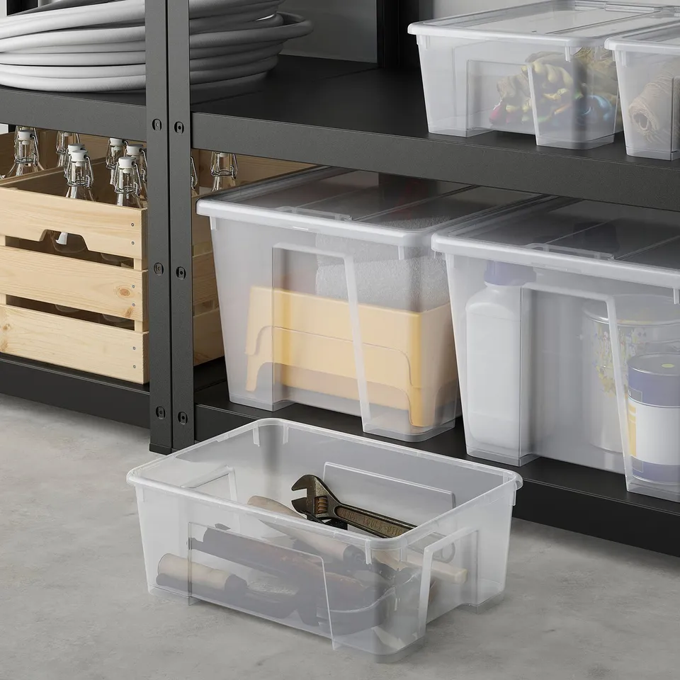 SAMLA containers, some on floor and shelves.