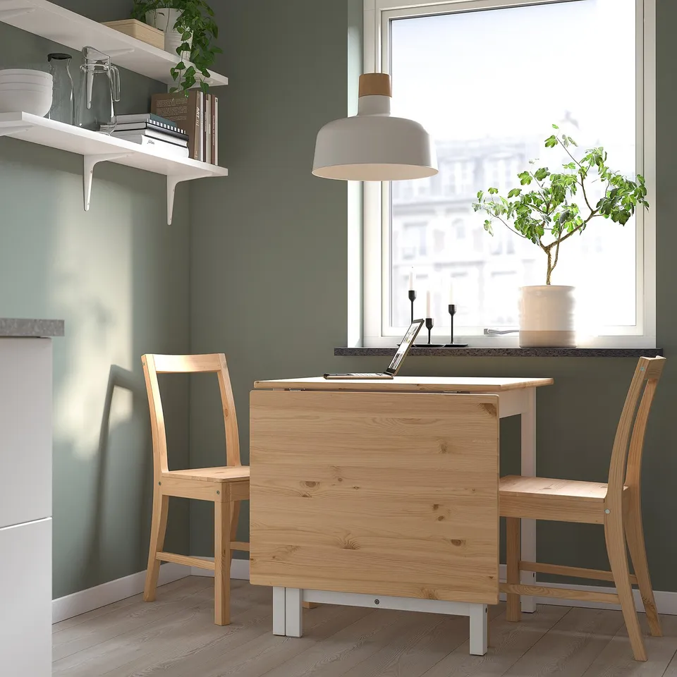 PINNTORP drop-leaf table with 2 chairs, green wall, light, plant - space-saving.