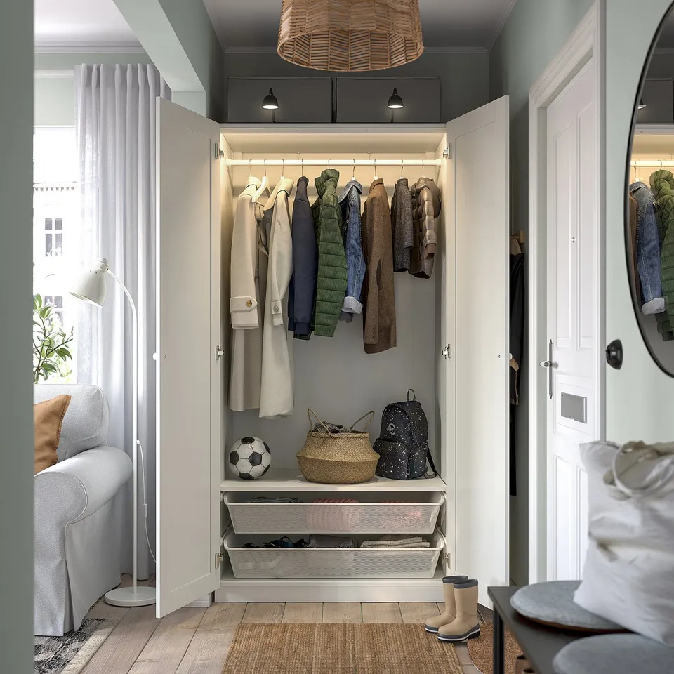Modern closet showing hangers, shelves, and baskets for organised storage.