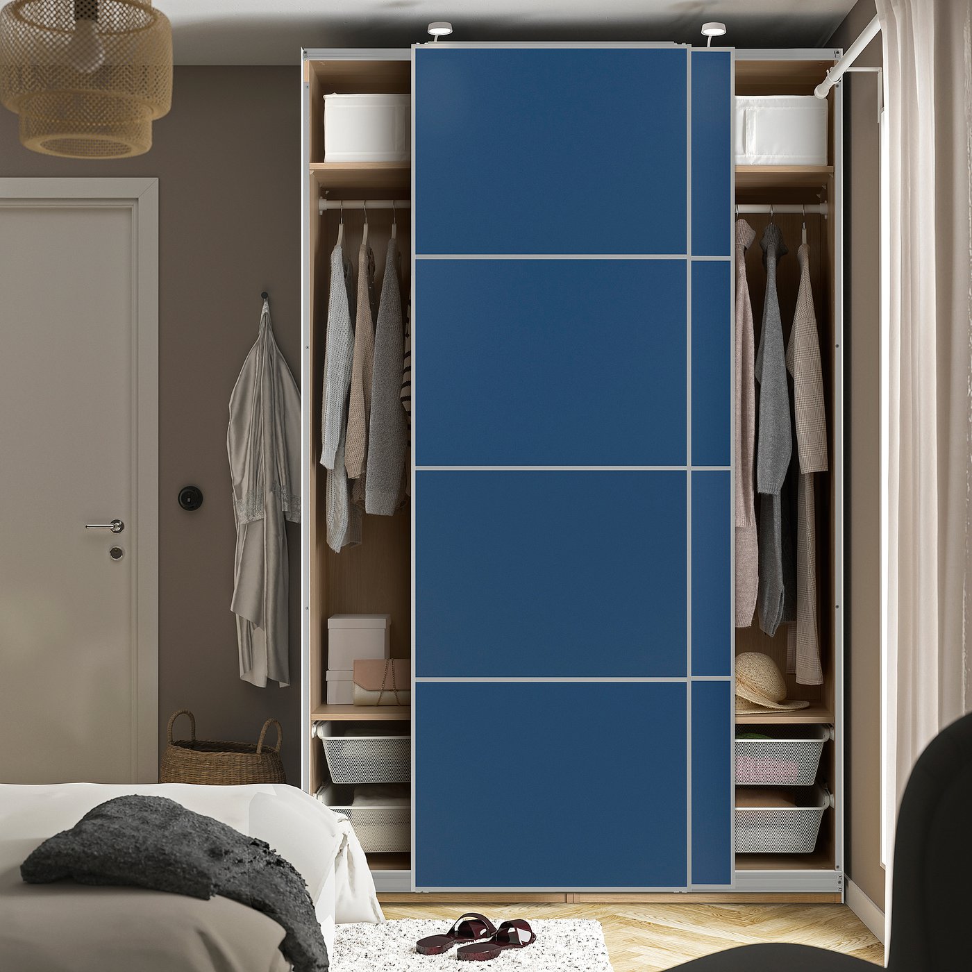 Open blue sliding closet reveals clothes, shelves, and storage boxes, showcasing organised wardrobe space.