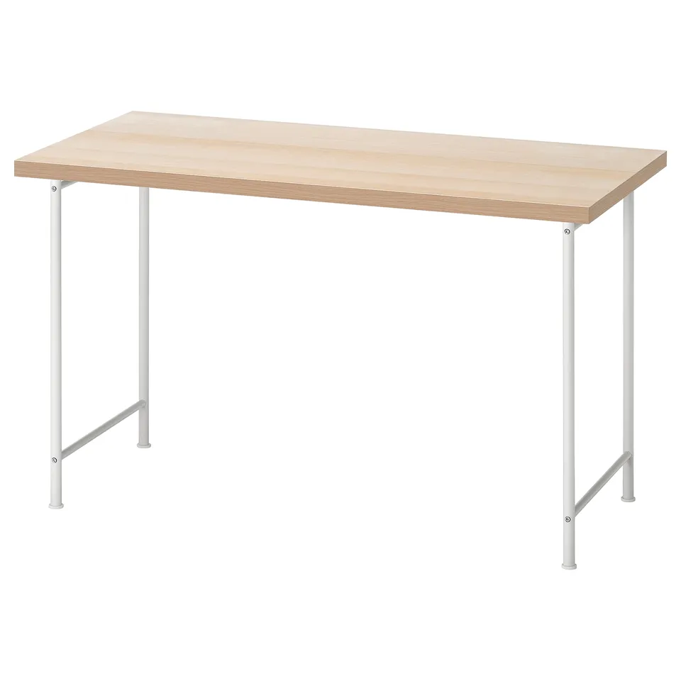 A LAGKAPTEN desk with a light wood top and white metal legs. Its rectangular, modern, and environmentally friendly.
