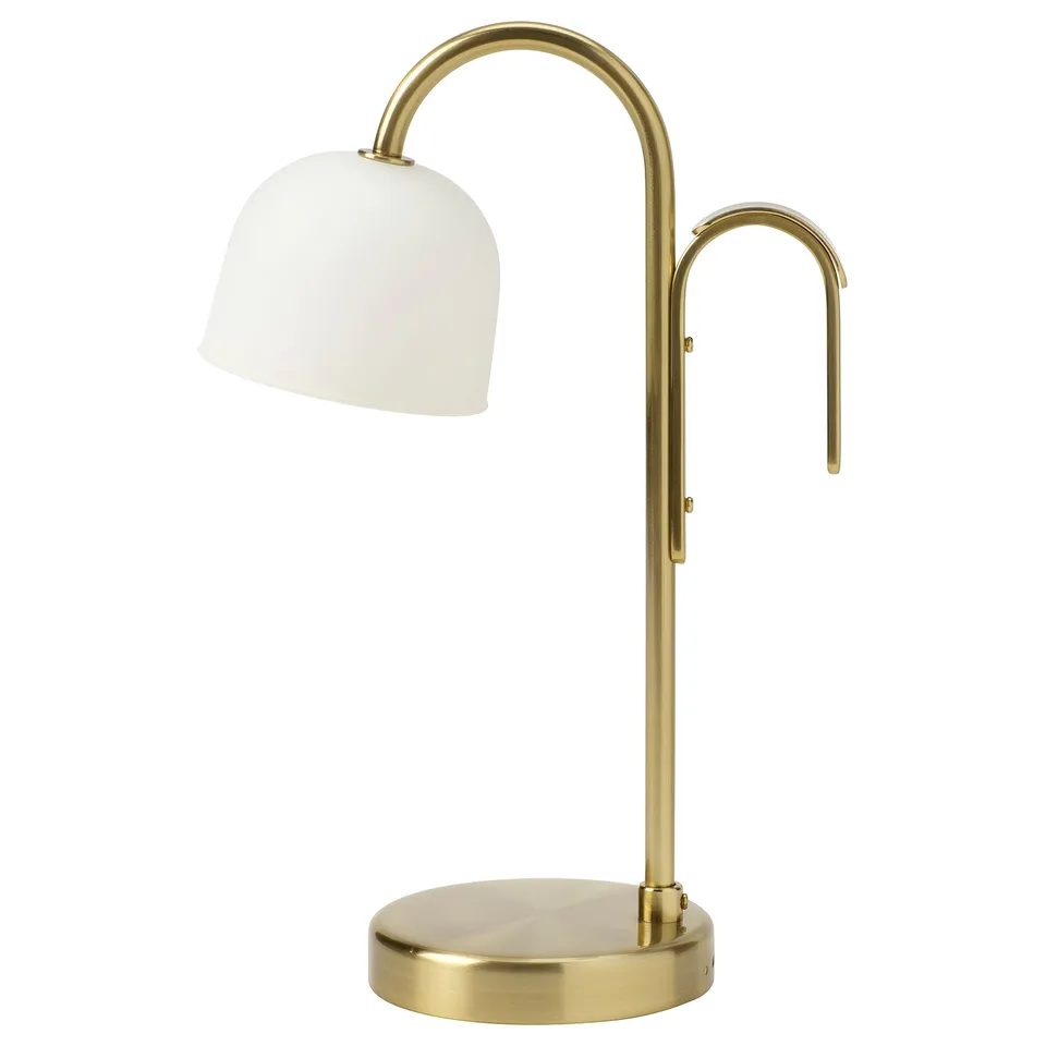 A gold-colored portable lamp named TVÅMASTAD with a frosted glass shade and a handle for easy transport.
