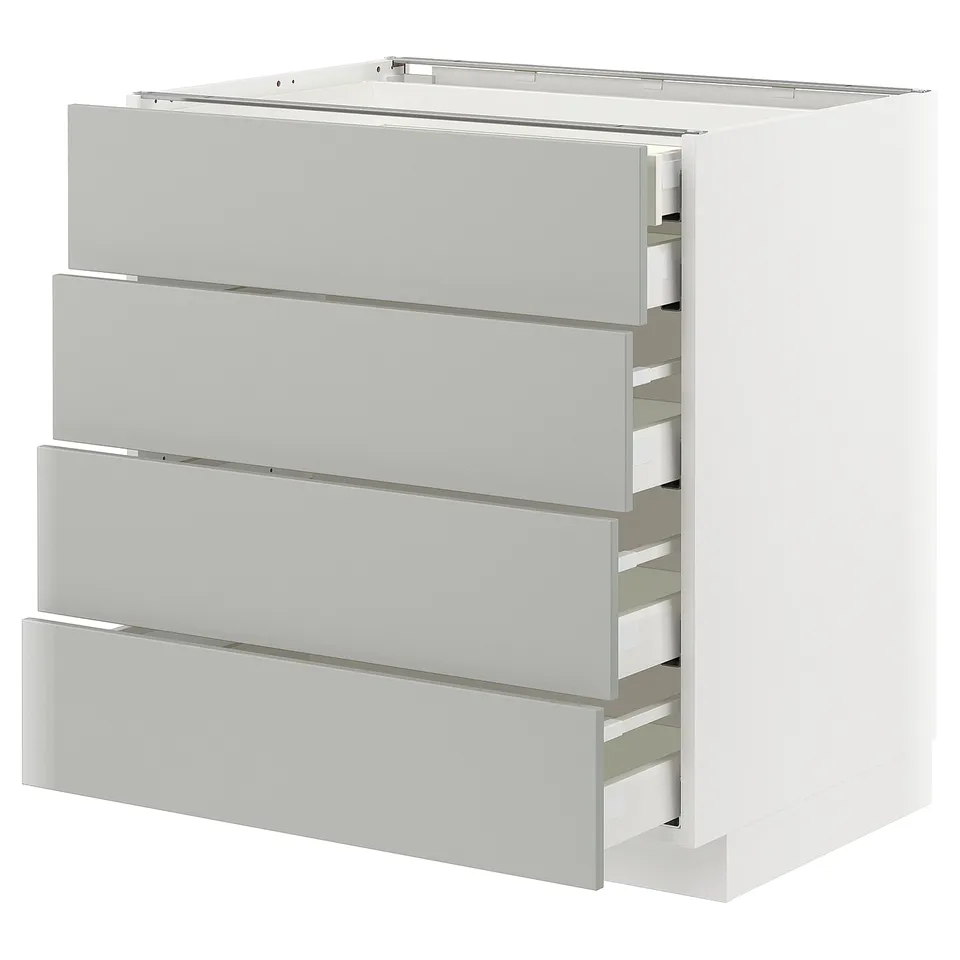 Modern grey ikea METOD kitchen cabinet with four open drawers, sleek and organized.