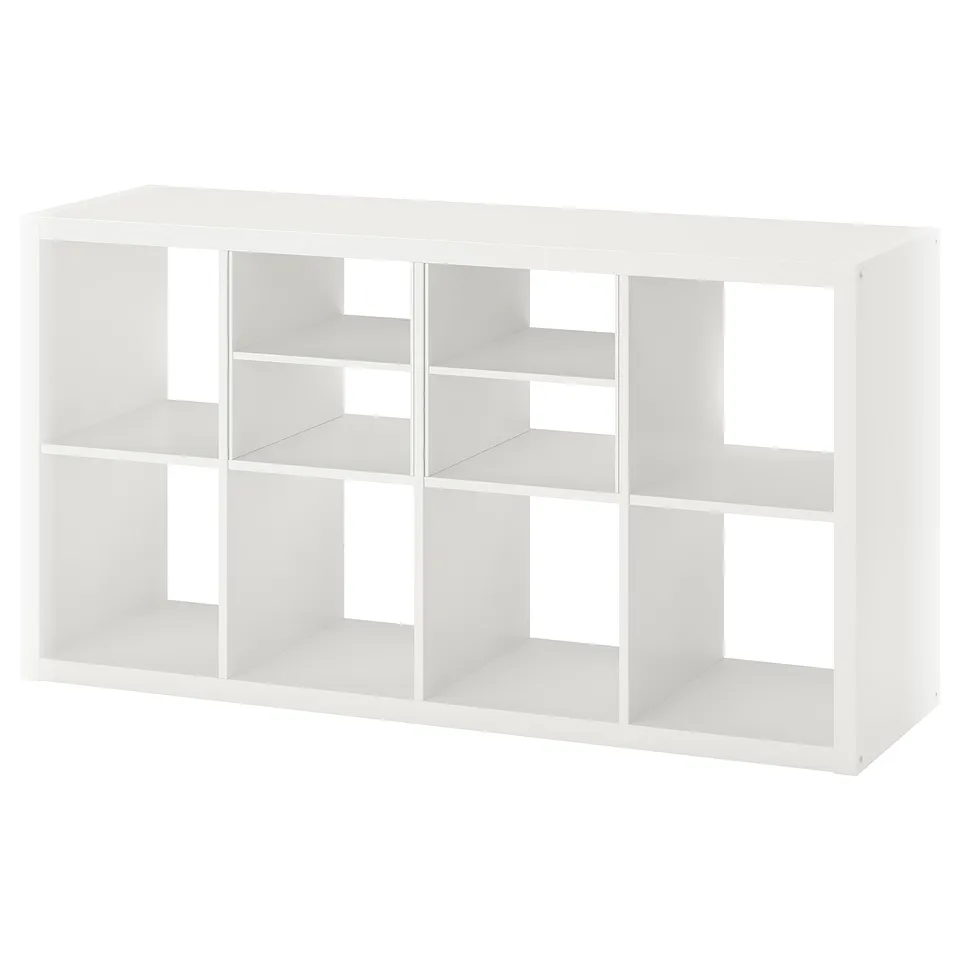 Displays a white ikea KALLAX shelving unit made of particleboard and fiberboard, featuring an open cube design for versatile storage.