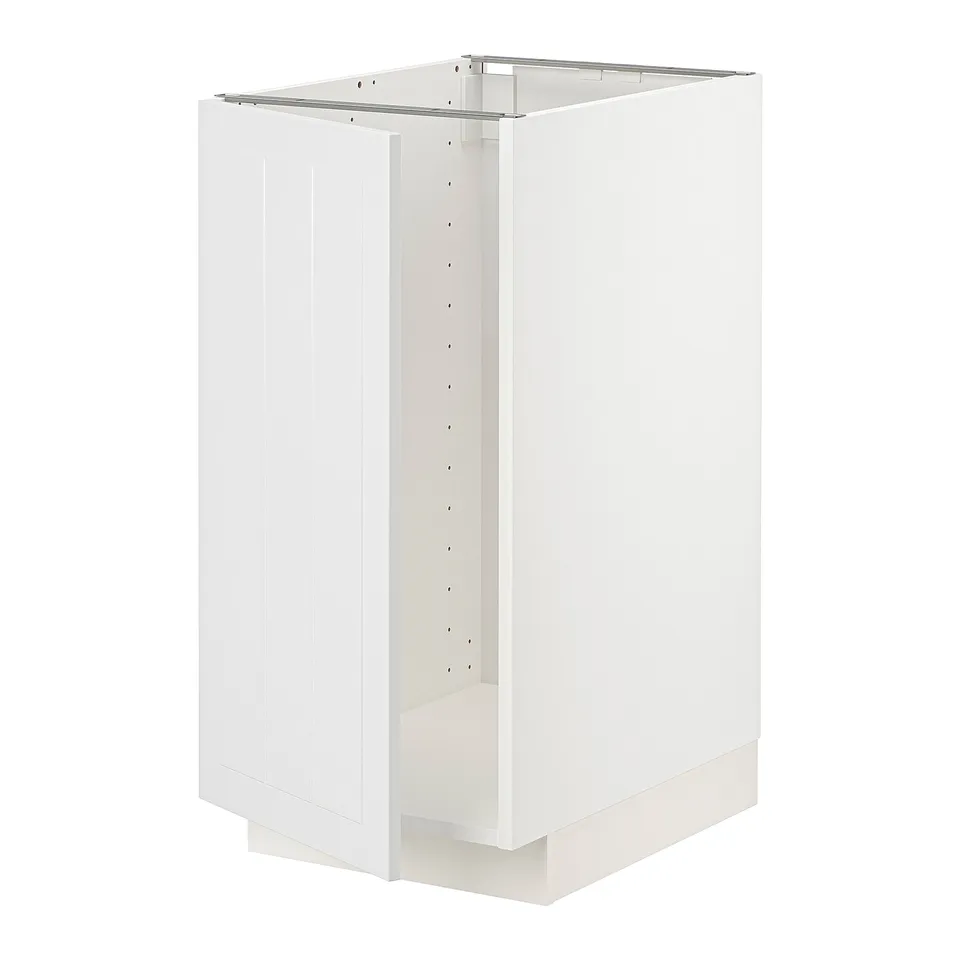 A white METOD kitchen cabinet. Its rectangular, with vertical grooves on the door, and a sturdy frame. Its designed for versatile kitchen storage.
