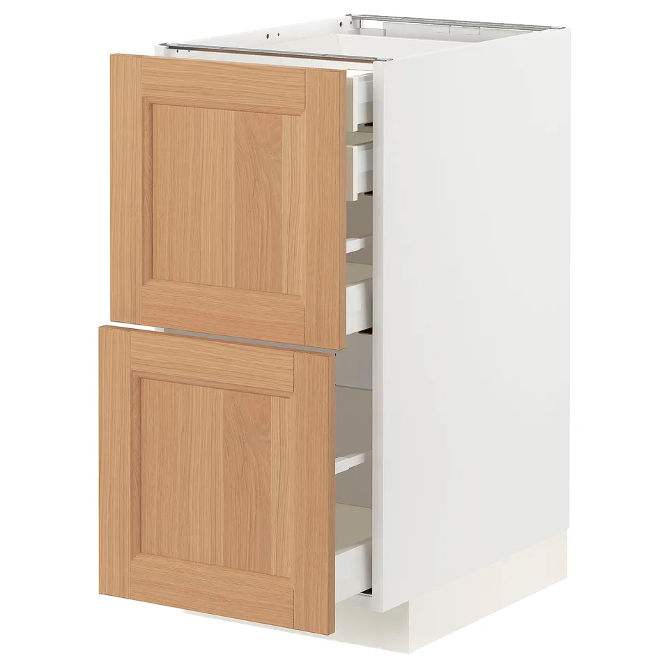 White kitchen cabinet with wooden drawers, featuring multiple sliding drawers.