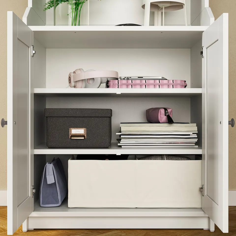 White HAUGA storage cabinet with shelves holding storage boxes and files.