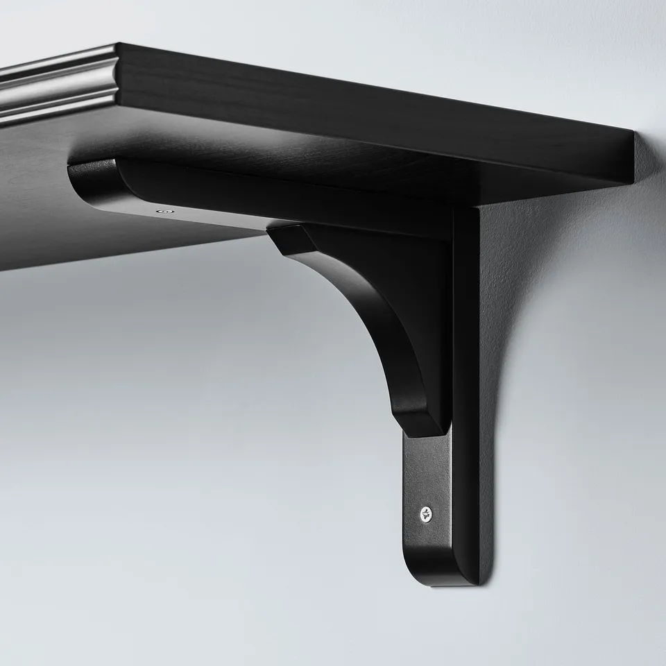 Black wall shelf mounted with sturdy bracket, smooth finish, minimalist design.