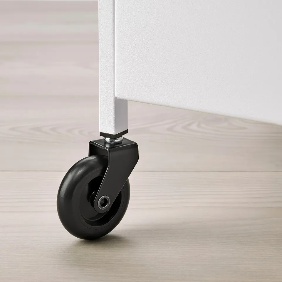 Close-up of a modern, sturdy trolley wheel on a light wooden floor. Shows quality and design.