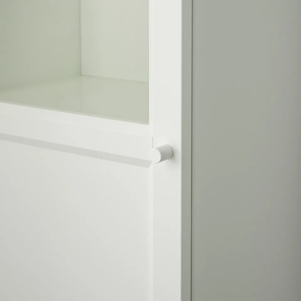 White cabinet door with sleek handle, made of sturdy materials, shows clean design.