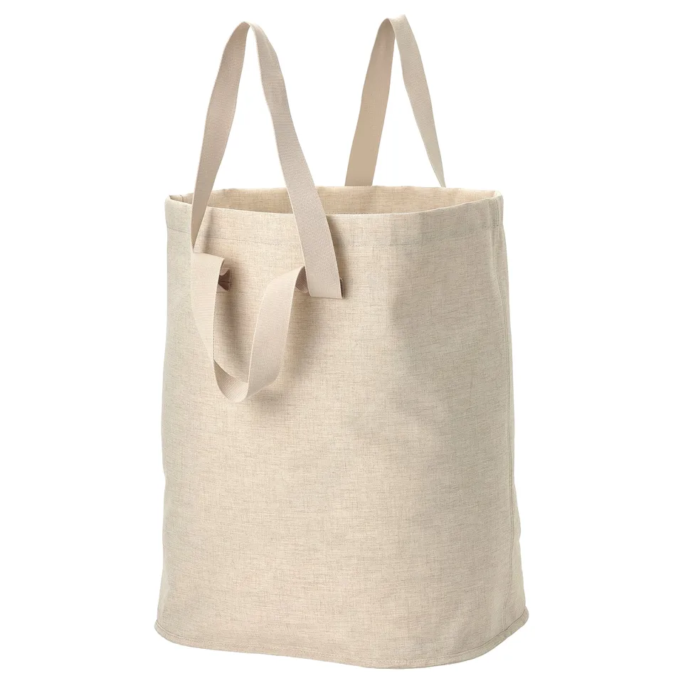 Beige eco laundry tote with handles & drawstring.