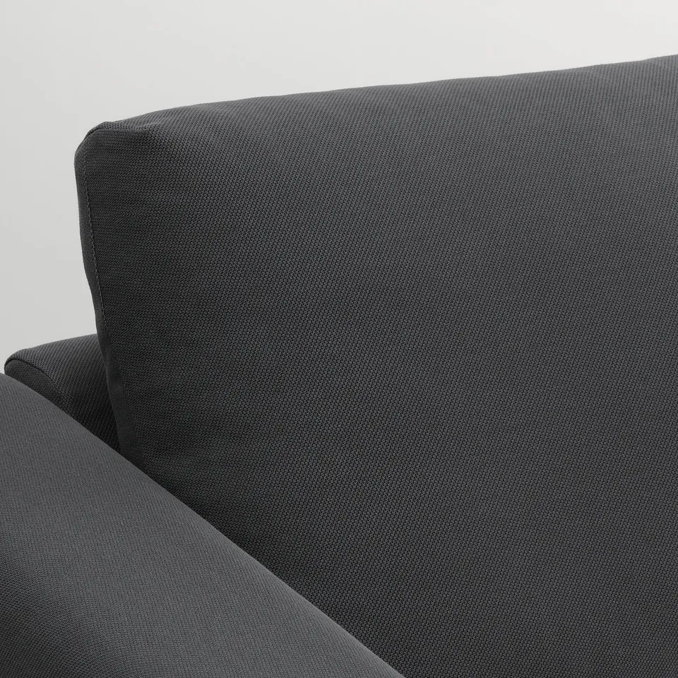 Close-up of VIMLE sofas high-quality, smooth, dark fabric. Cushioned comfort and modern design.
