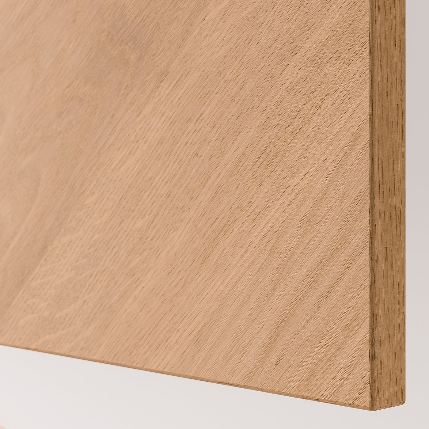 Close-up of smooth, light wooden panel, likely part of a cabinet, showcasing high-quality finish and fine wood grain texture.