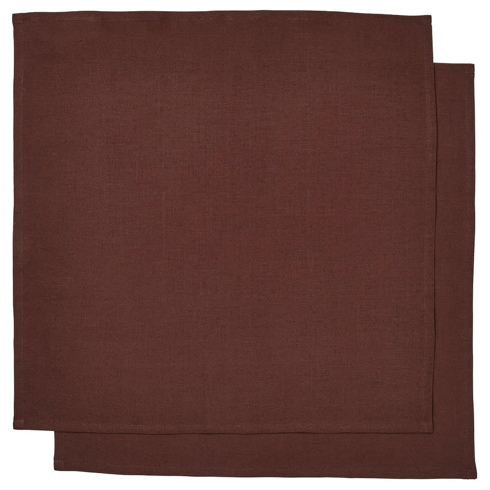 Two dark brown rectangular linen napkins, neatly stacked, showcasing natural texture and simple design.