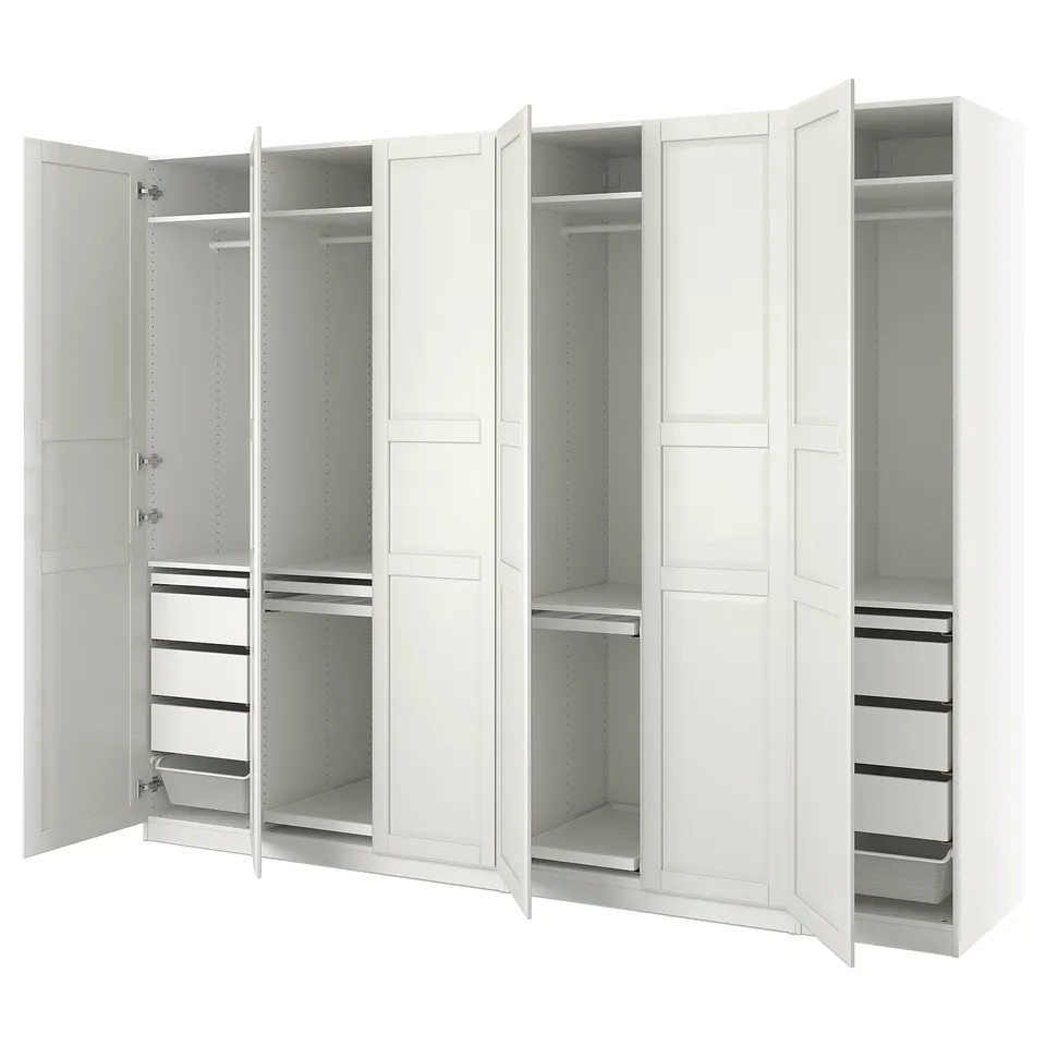 Its a white PAX wardrobe set with open doors, showing shelves, drawers, and hanging space.