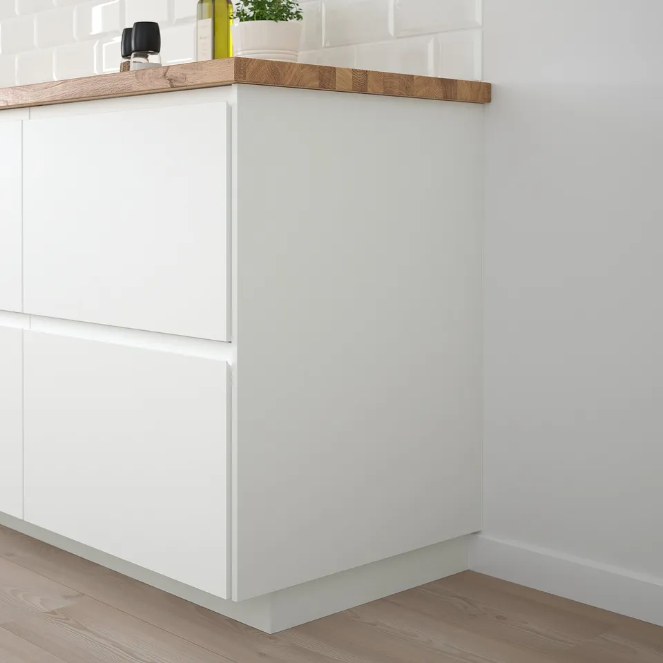 White FÖRBÄTTRA kitchen cabinet, sleek and modern, fits corner neatly.