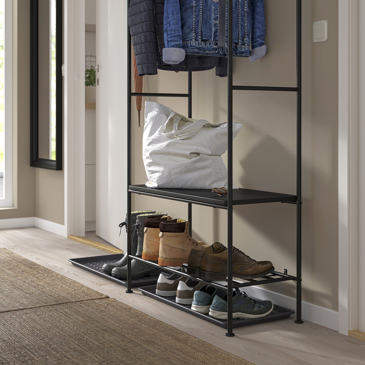 Entryway organiser with shoe rack, clothes shelf, and hanging rack for coats and bags.