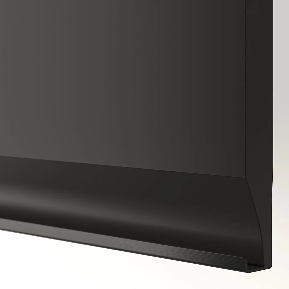 Modern black cabinet with sleek, chamfered edges and integrated handle, showcasing high-quality design and material.