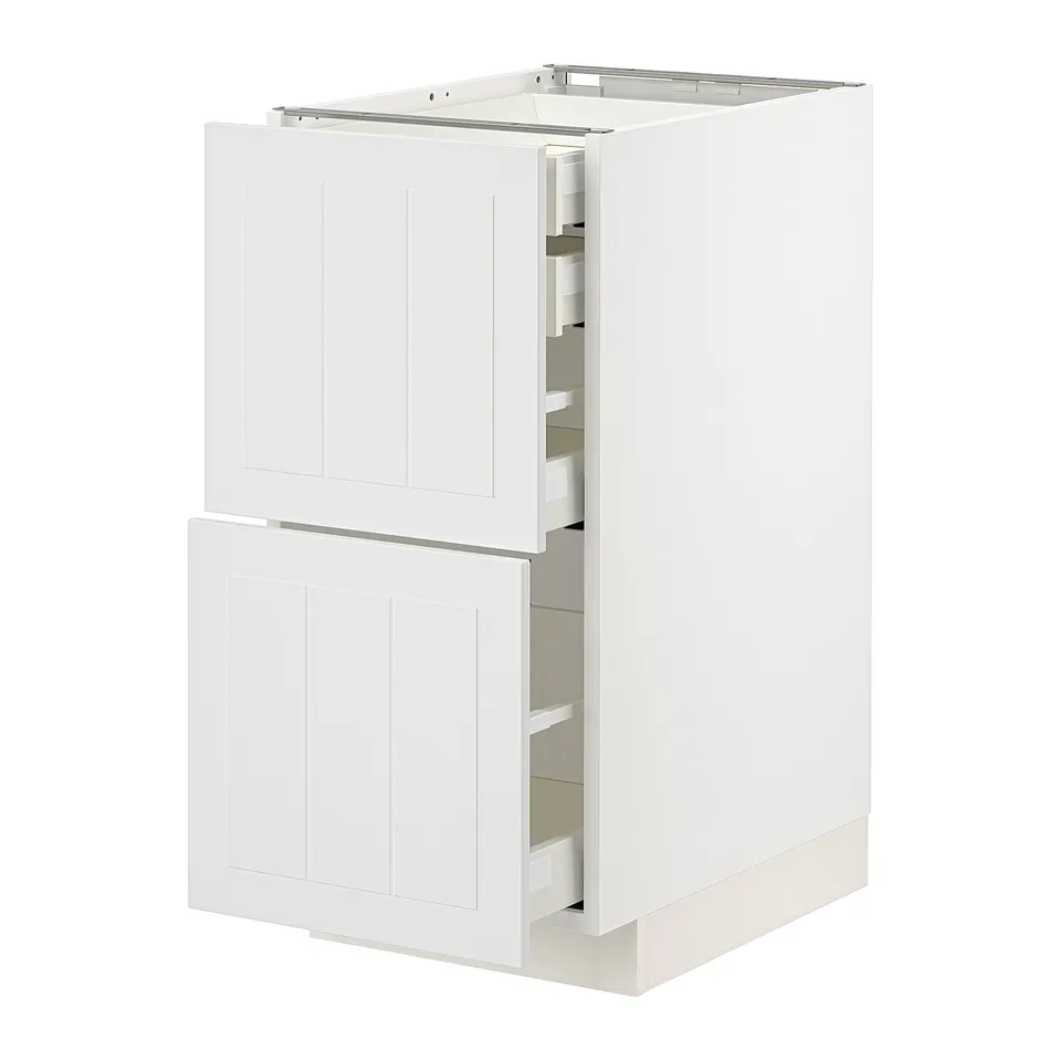 White METOD kitchen cabinet with open drawers and doors, featuring a smooth and crafted design.