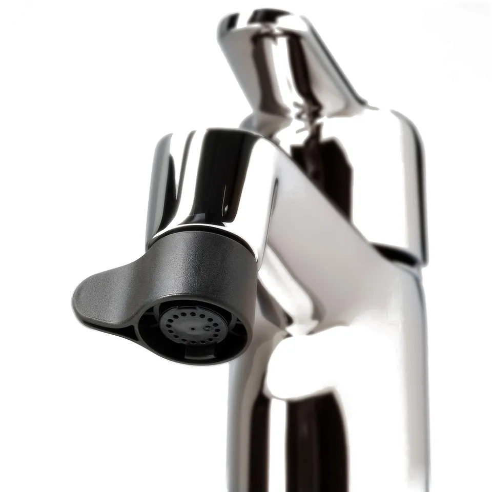 Shiny chrome tap with modern nozzle, ergonomic design for water efficiency.