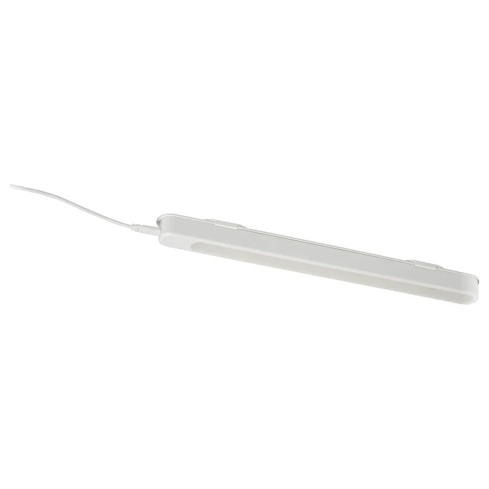 A white ROLFSTORP lightweight lamp with usb power. Its slim shape and self-adhesive design make it versatile for various spaces.