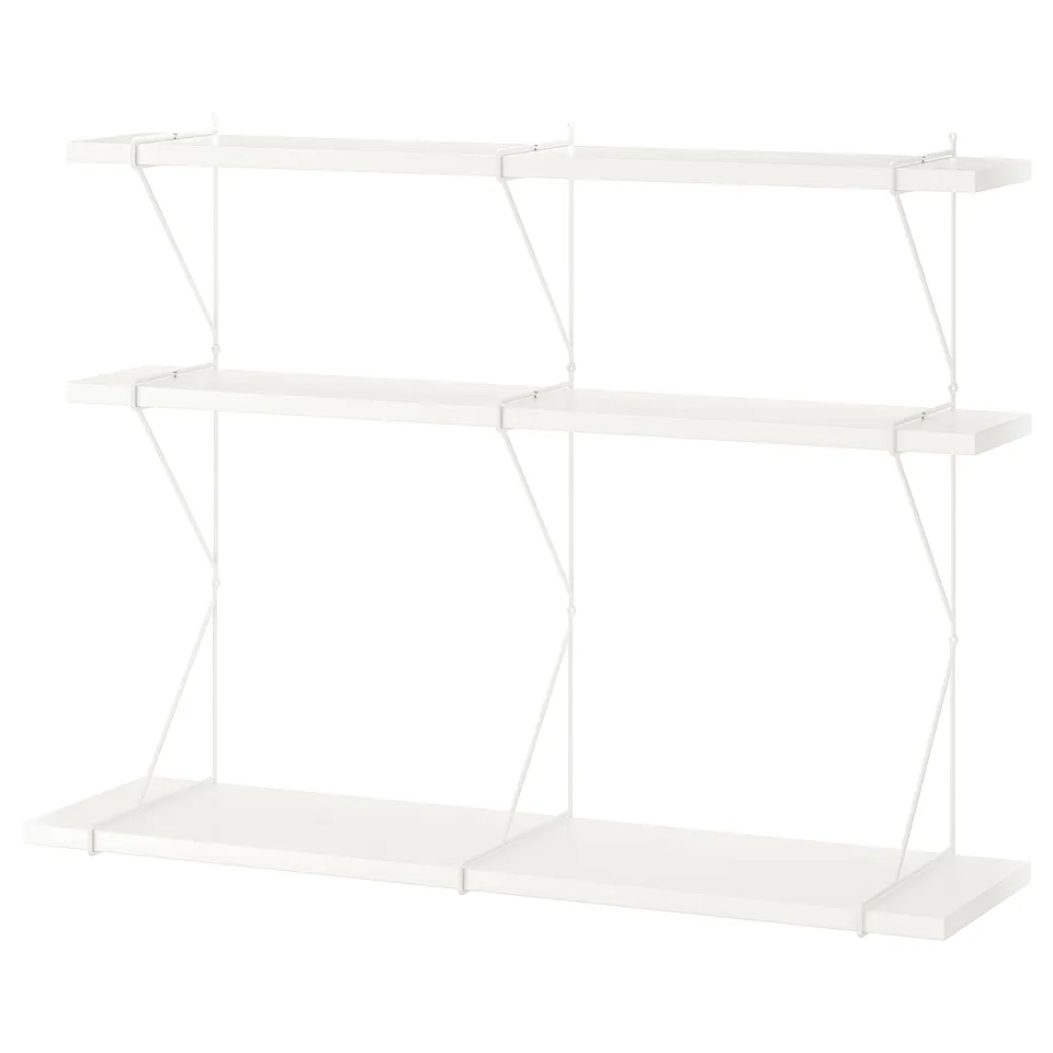 A white BERGSHULT wall shelf with three flat surfaces supported by metal brackets. Modern, versatile design.