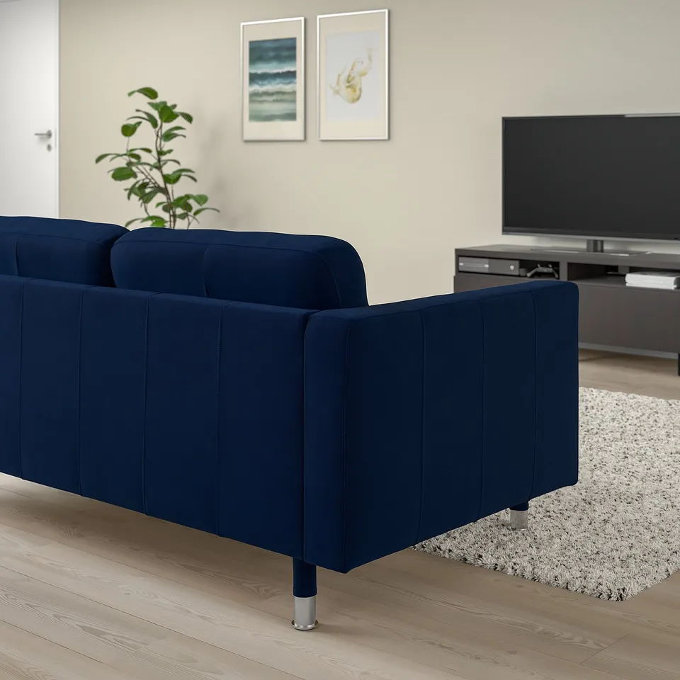 Navy blue LANDSKRONA sofa in living space with tv and rug.
