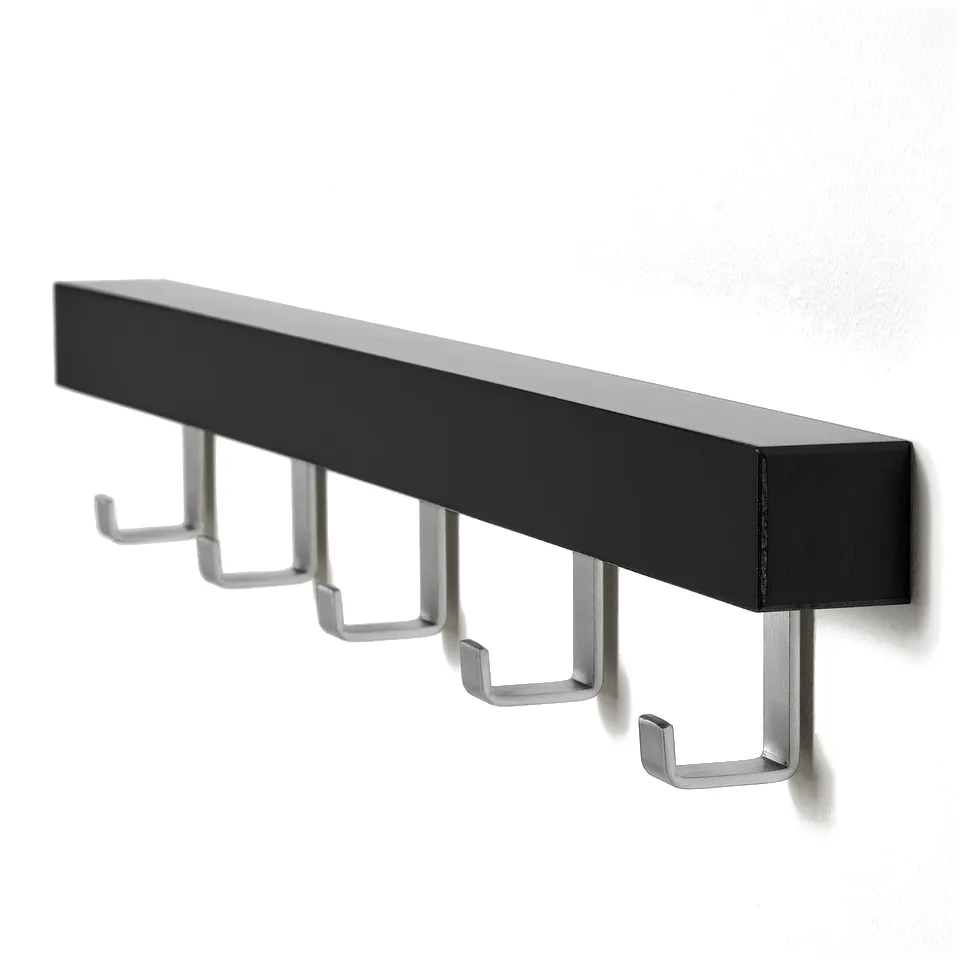 Black wooden shelf with five silver hooks evenly spaced, mounted on a white wall. Modern, sturdy design for hanging items.