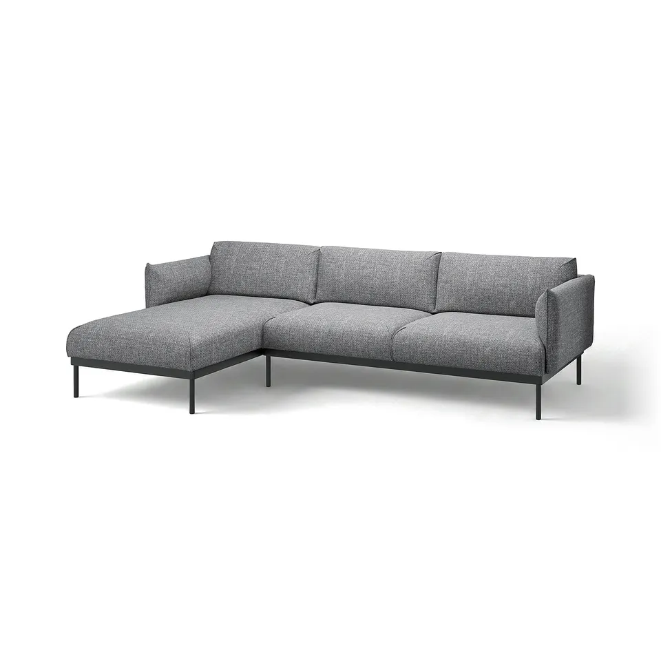 Modern l-shaped grey fabric sofa with metal legs.