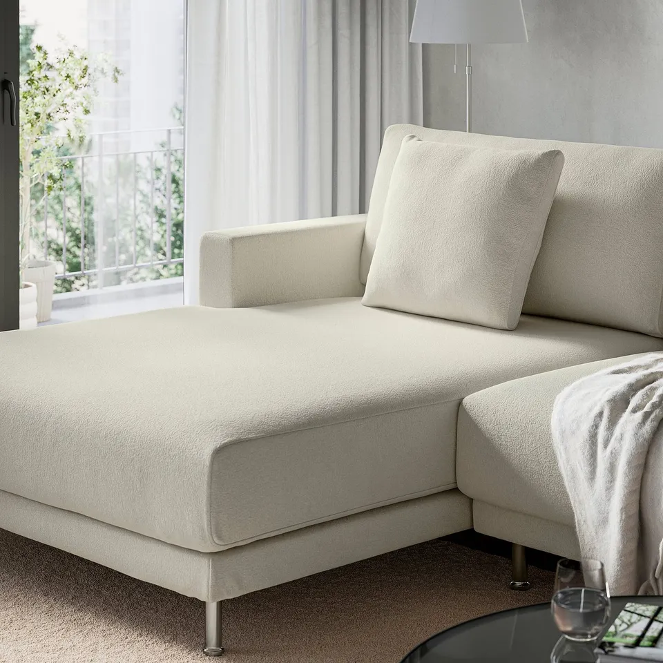 A modern living room a cream-colored UPPÅKRA sofa with oversized cushions offering comfort and an inviting atmosphere.