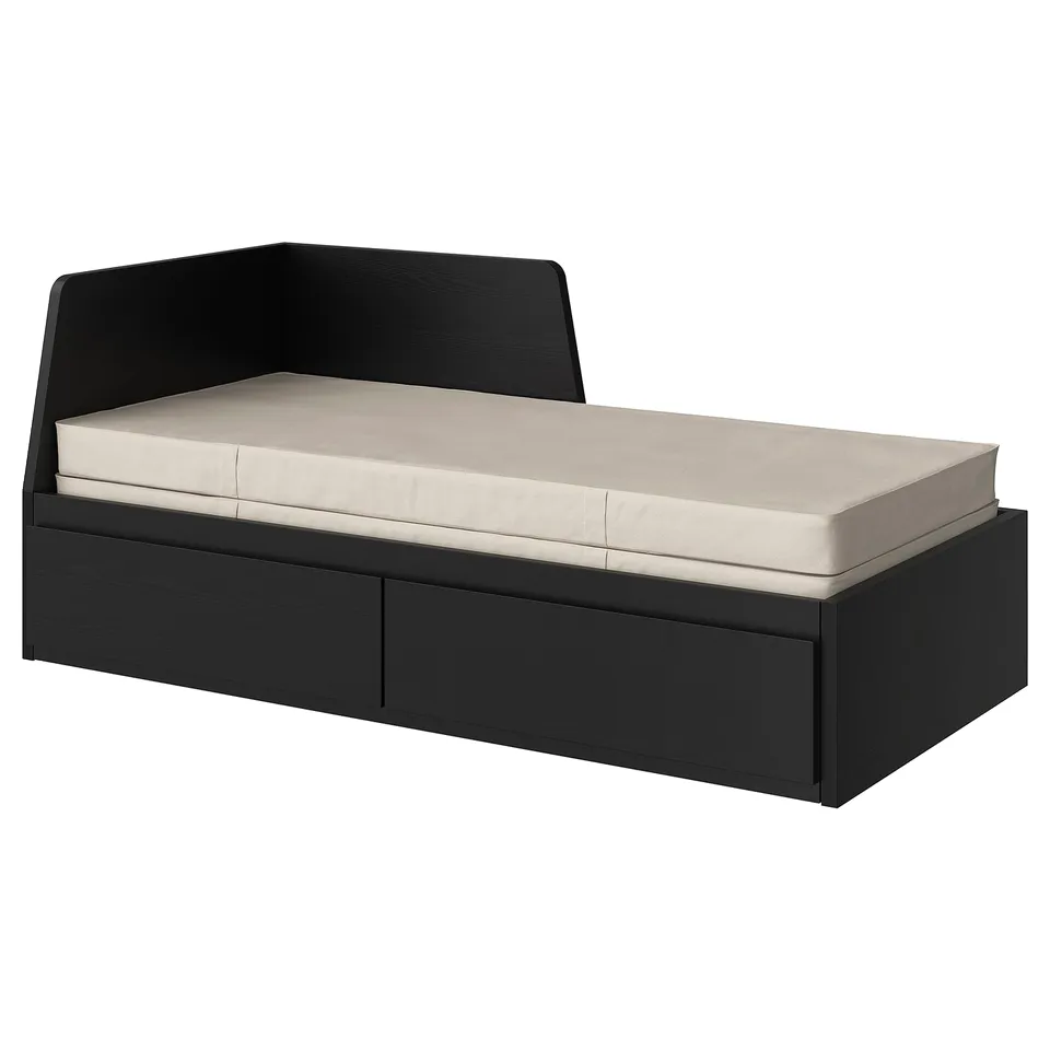 A black FLEKKE day-bed with two storage drawers and a beige mattress, suitable for small spaces.